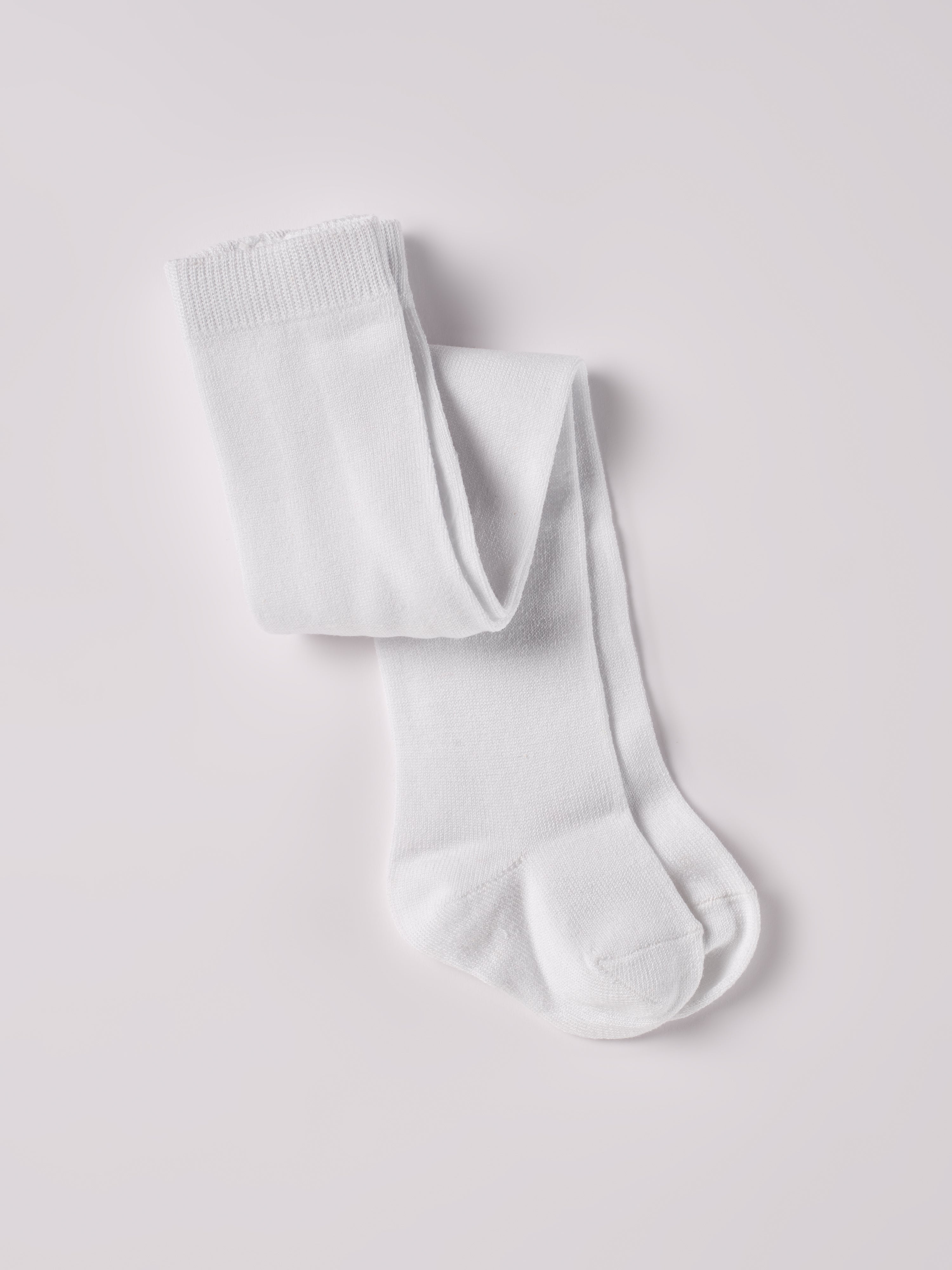 Ein zeitloser Klassiker und Grundausstattung für Ihr Kind: Die weiße Strumpfhose von AMIO Firenze. Diese Kinder-Strumpfhose ist vielseitig kombinierbar und verleiht jedem Outfit eine elegante Note. Die Strumpfhosen zeichnen sich durch einen besonders hohen Tragekomfort aus. Sie verrutschen nicht und halten ihre Form.&nbsp;

Höchste Qualität, bestes Preis-Leistungs-Verhältnis MADE IN ITALY.